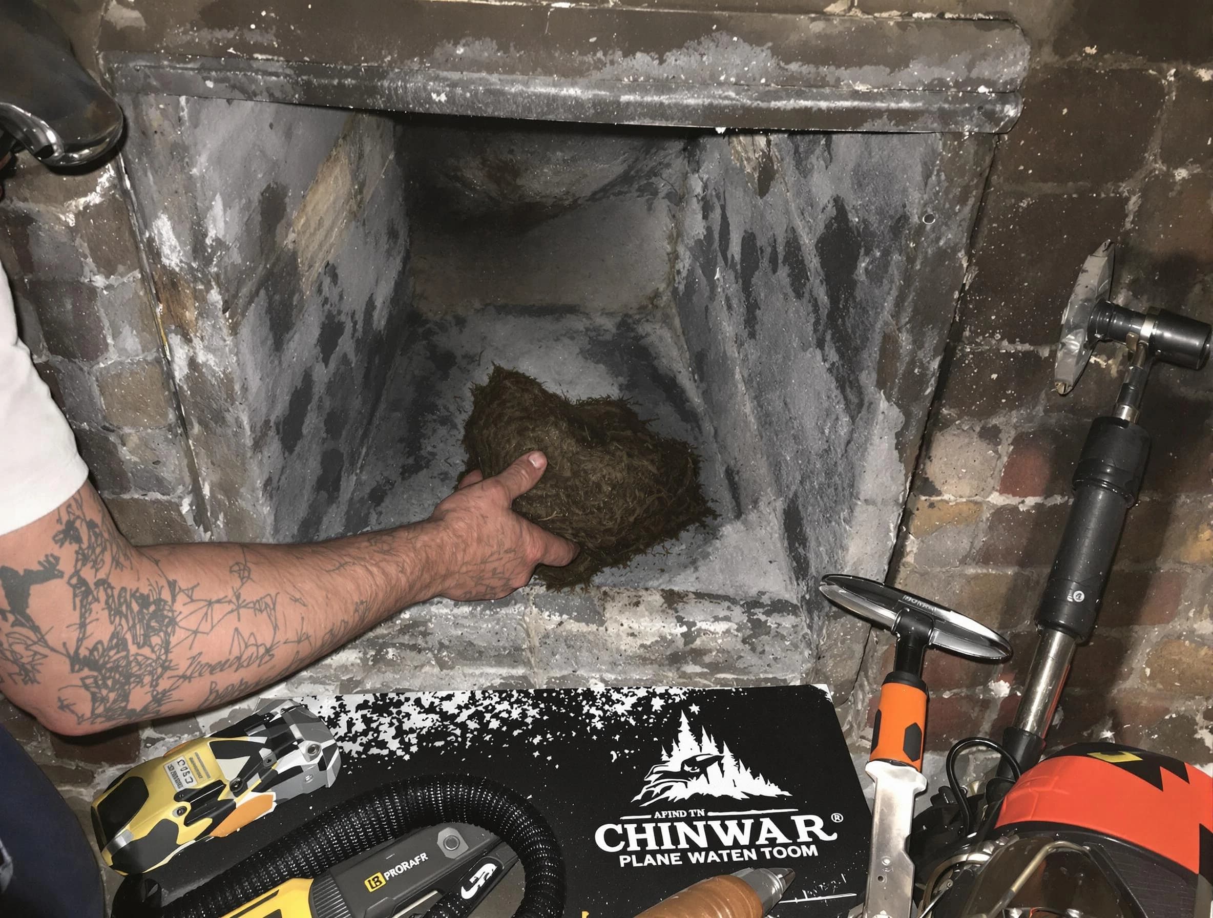 New River Chimney Sweep safely removing debris and screening chimney in New River, AZ